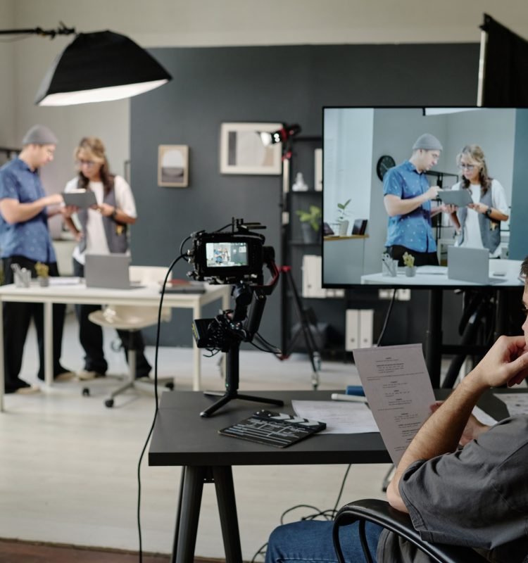 Man Sitting at Table and Reading Script